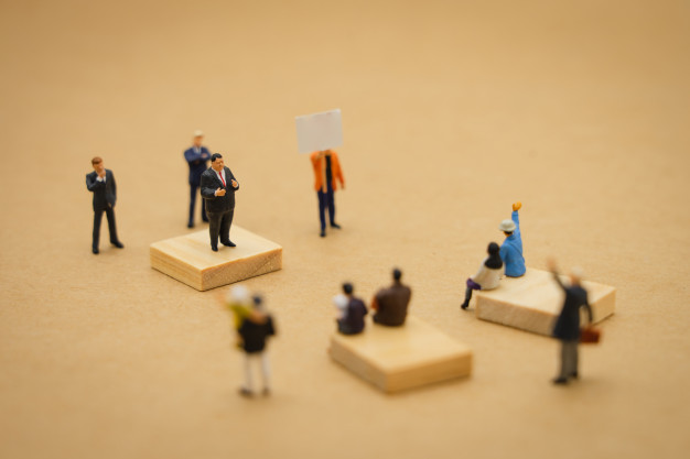 miniature-people-businessmen-standing-policy-statement-contend_24901-1036